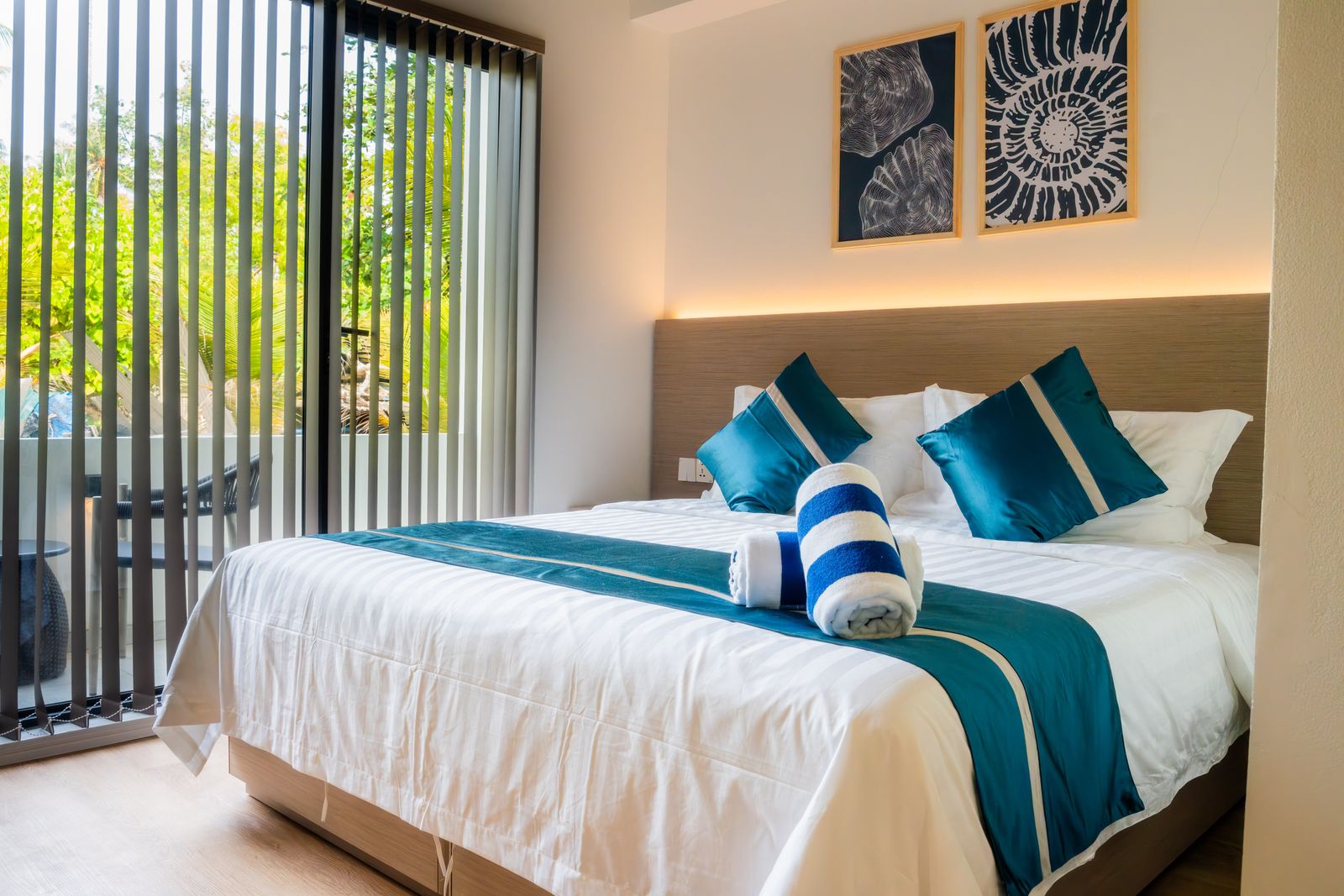 Deluxe room with sliding doors onto a private balcony