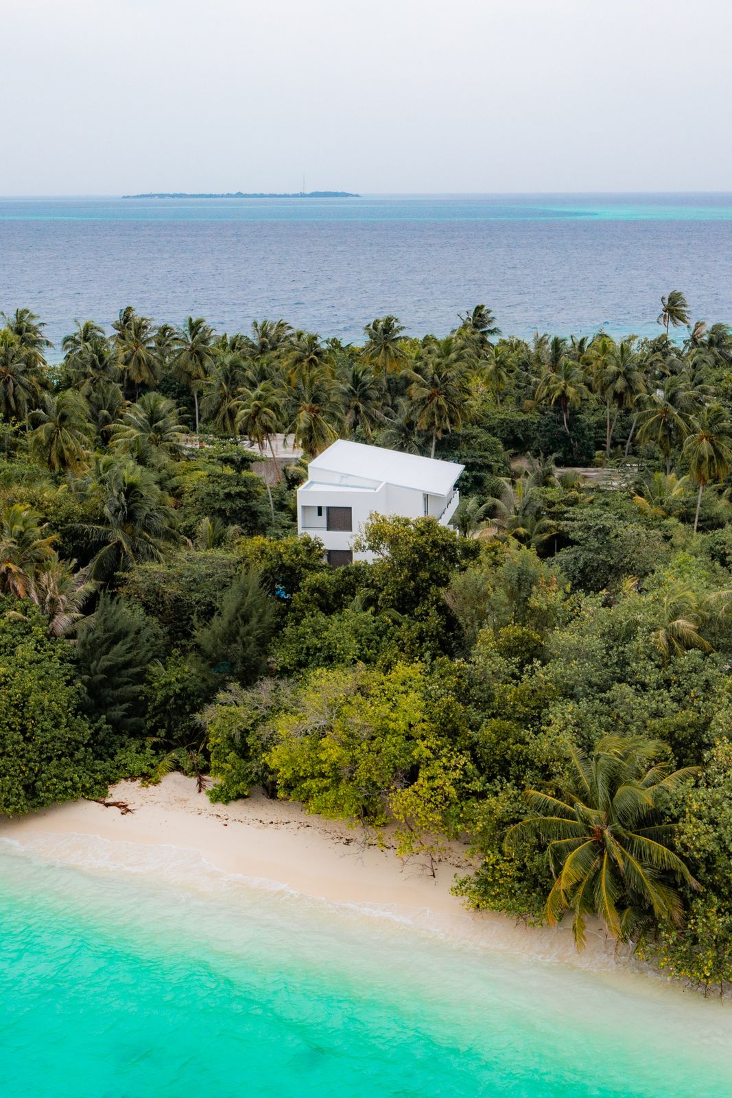 Kashiveli set back from the beach, reef stretching beyond