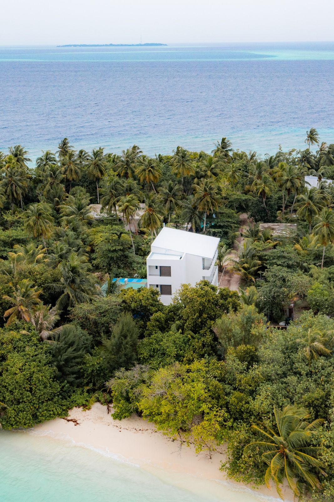Kashiveli looking out over deep blue toward a neighbouring island