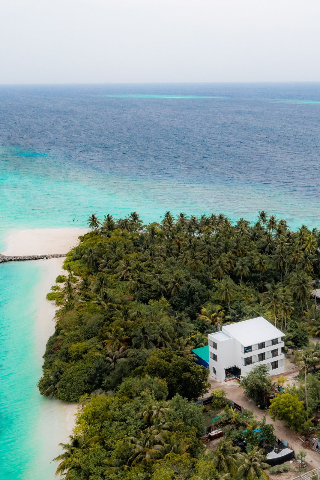 The guesthouse and the white sandbank at the island's edge