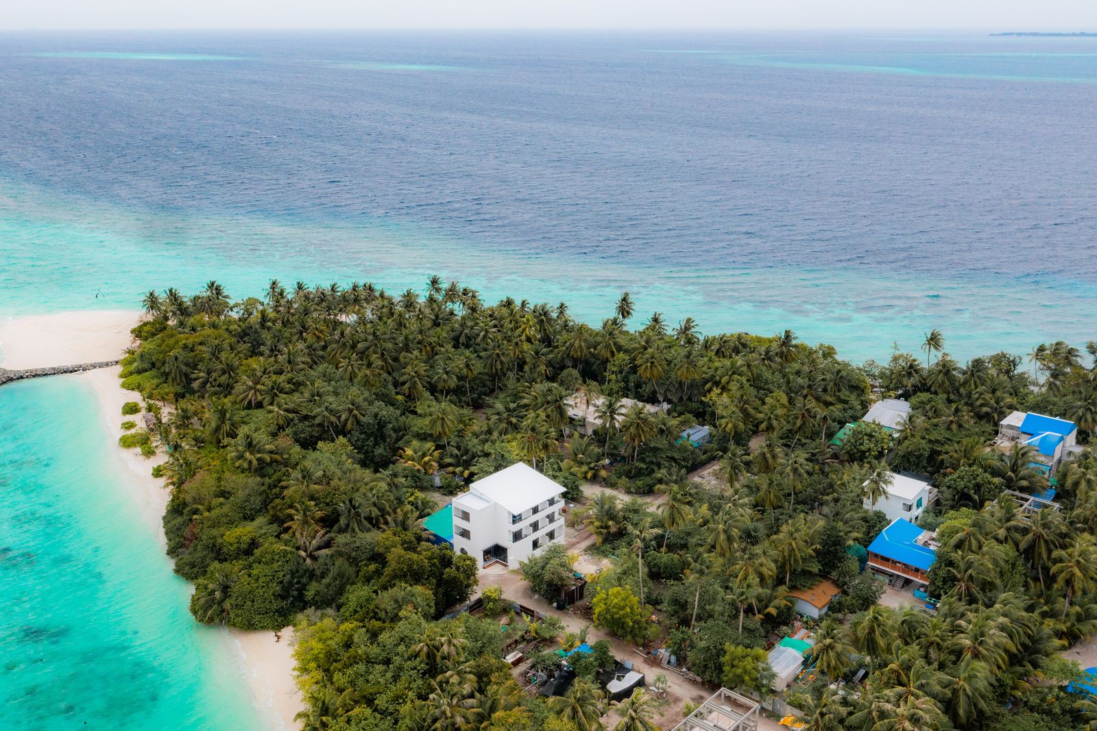 Omadhoo from the air, turquoise lagoon meeting the reef
