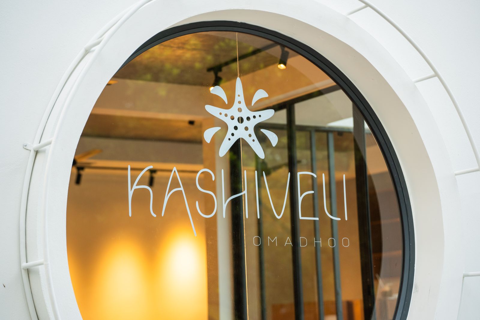 The Kashiveli starfish logo etched on the porthole glass