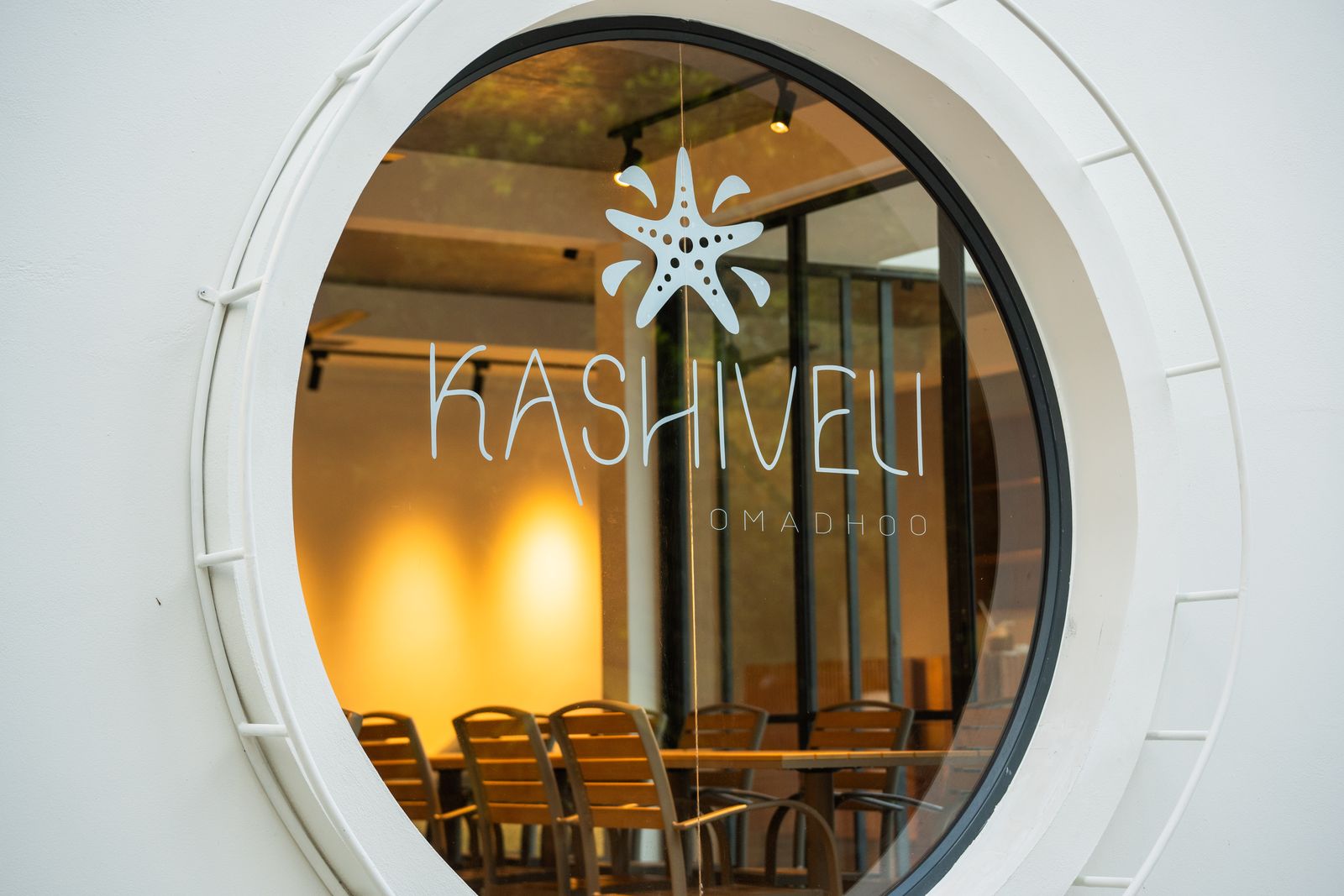 Kashiveli's porthole window looking into the garden café